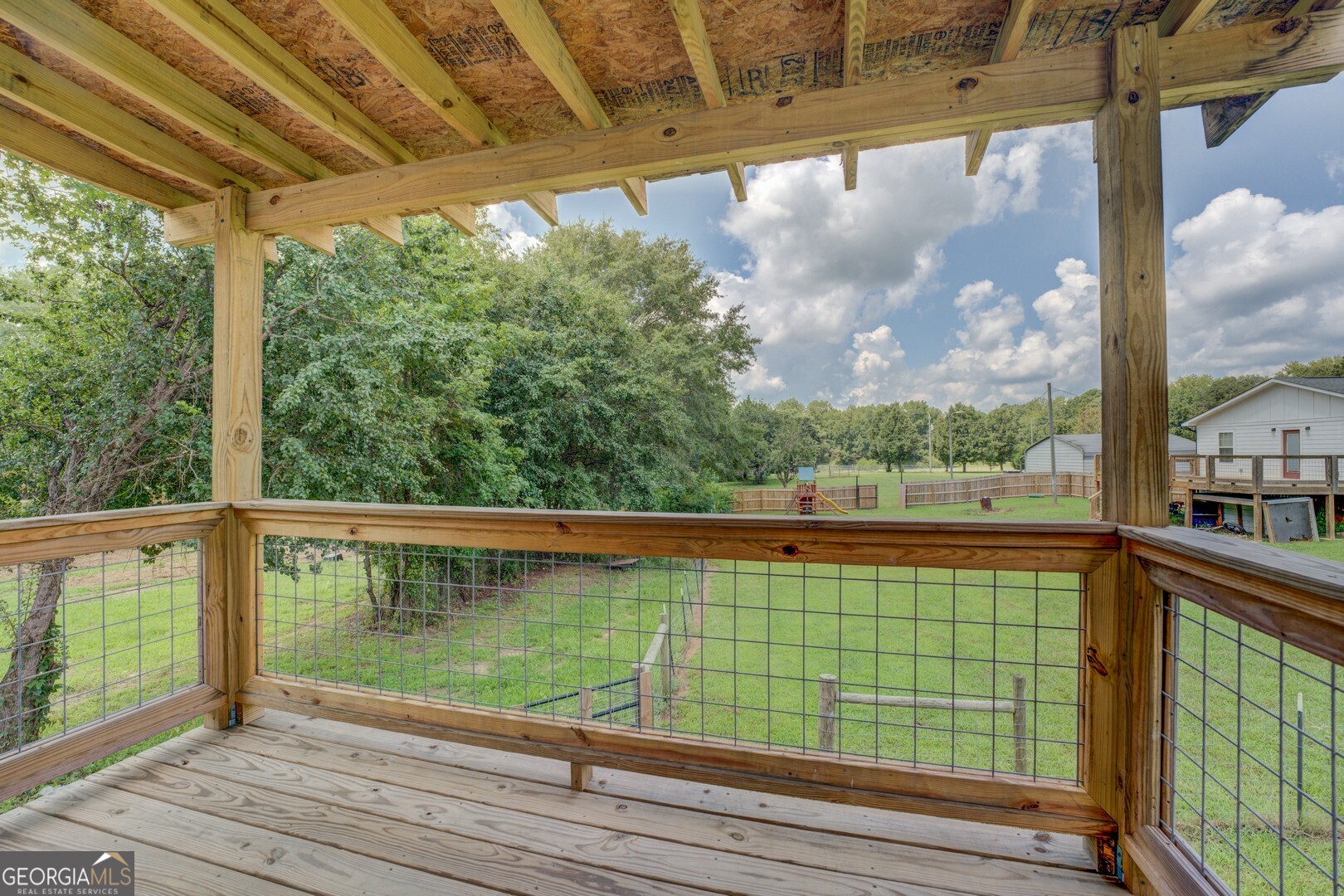 635 Jackson Lake Road Mansfield, GA 30055 - Photo 55 of 68 a view of a balcony with yard