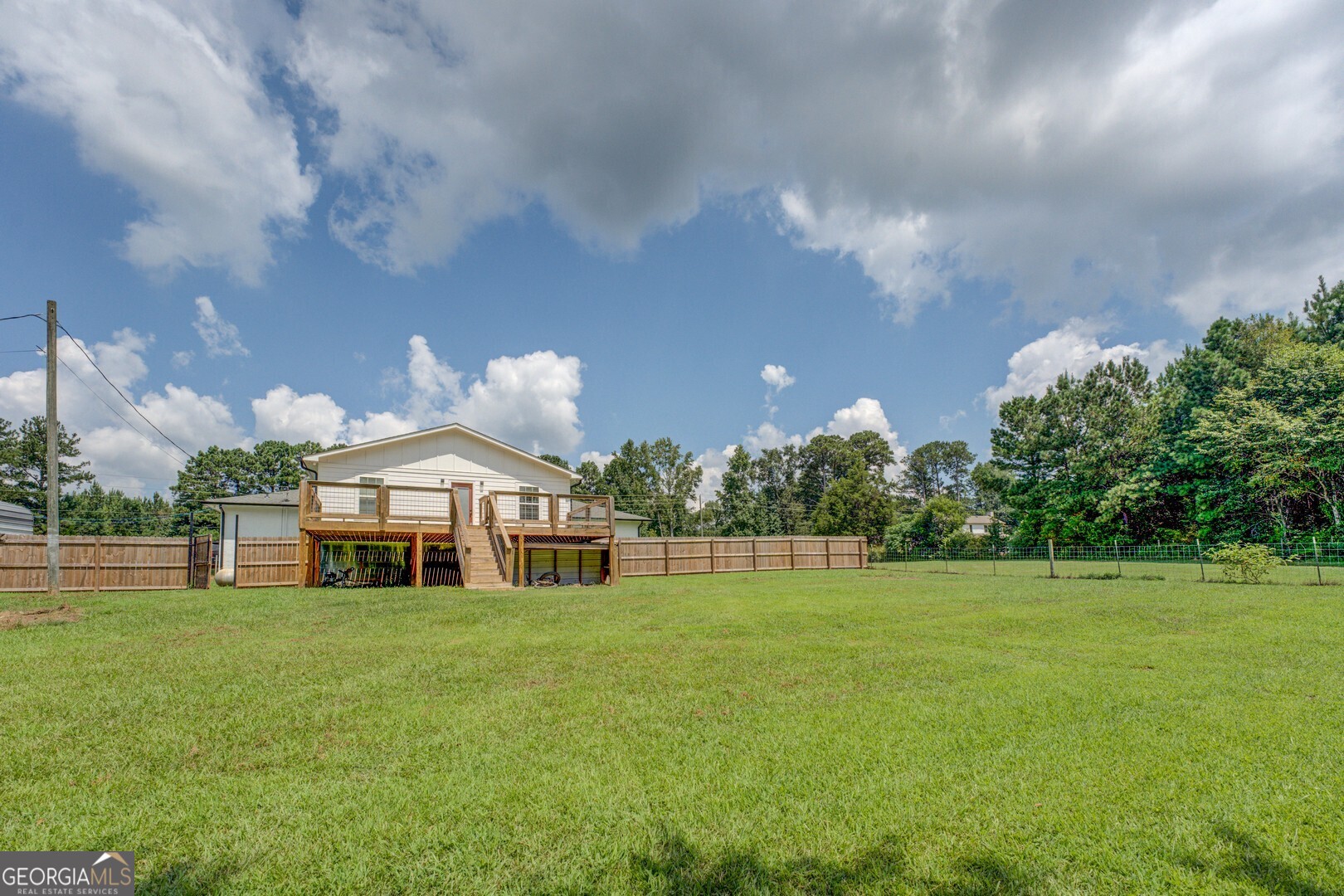 635 Jackson Lake Road Mansfield, GA 30055 - Photo 58 of 68 a front view of a house with a yard