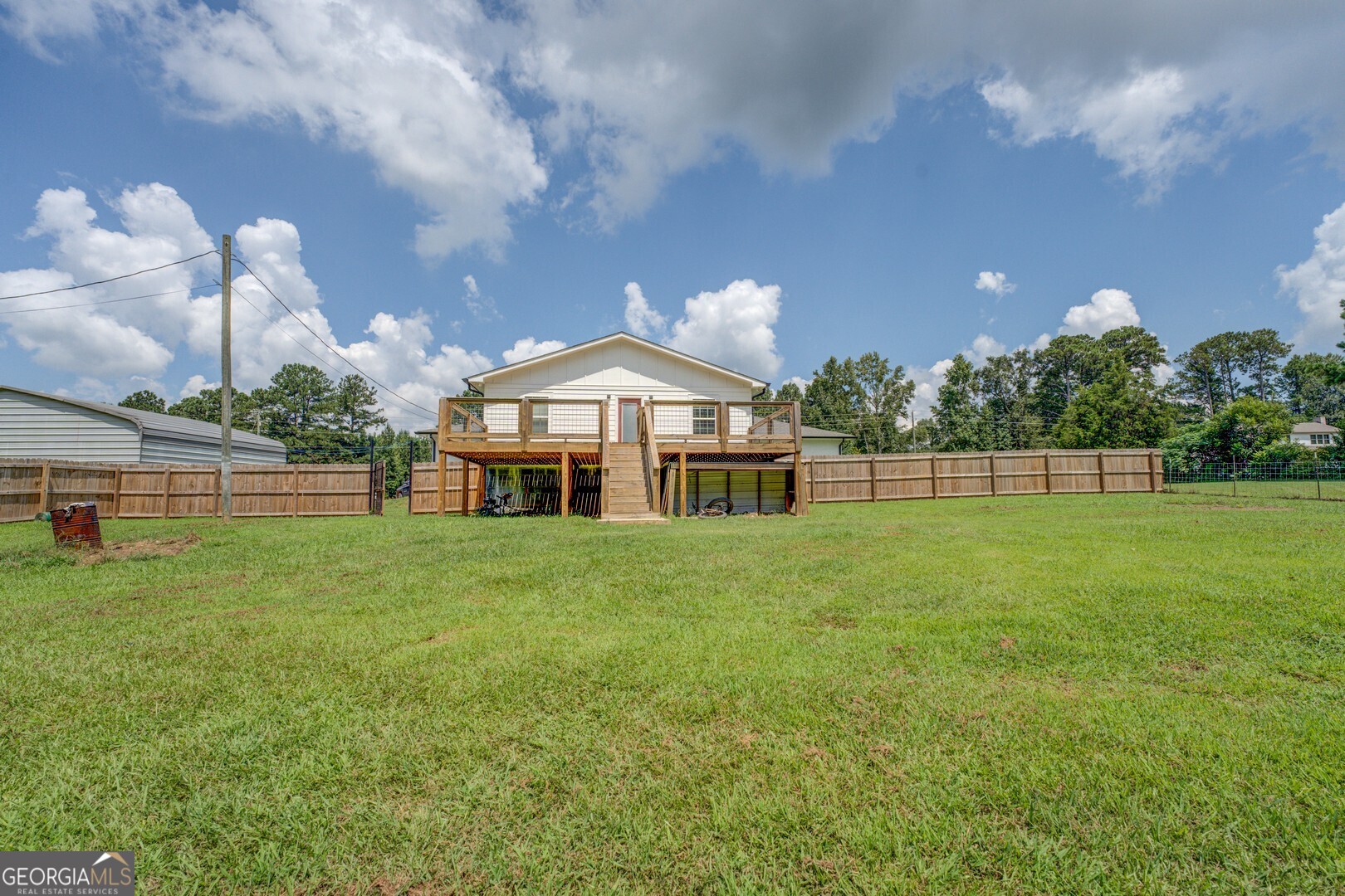 635 Jackson Lake Road Mansfield, GA 30055 - Photo 59 of 68 a front view of a house with a yard