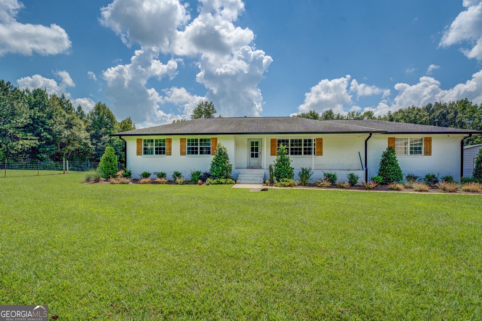 635 Jackson Lake Road Mansfield, GA 30055 - Photo 8 of 68 a view of an house with backyard space and garden