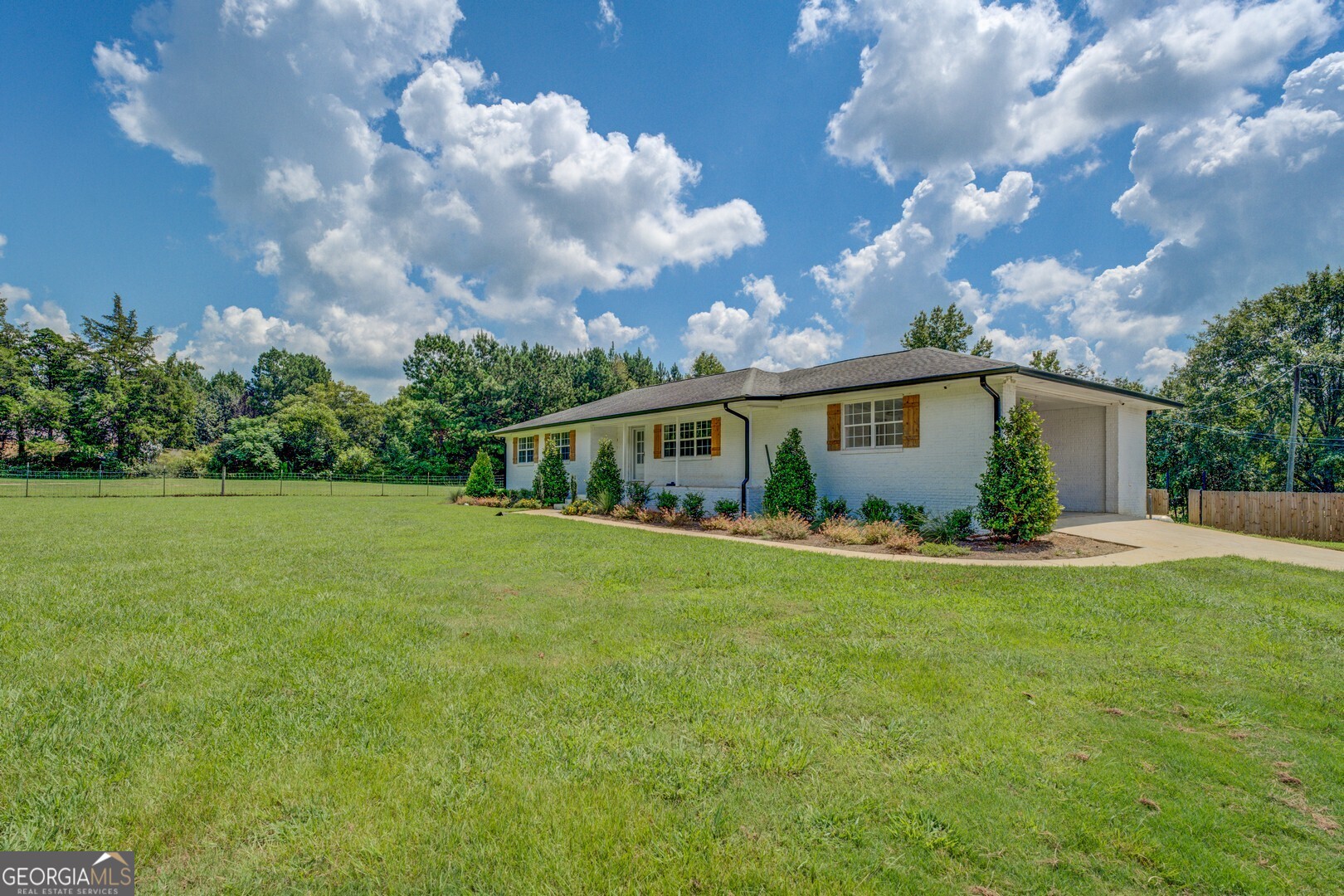 635 Jackson Lake Road Mansfield, GA 30055 - Photo 9 of 68 a front view of house with yard and green space