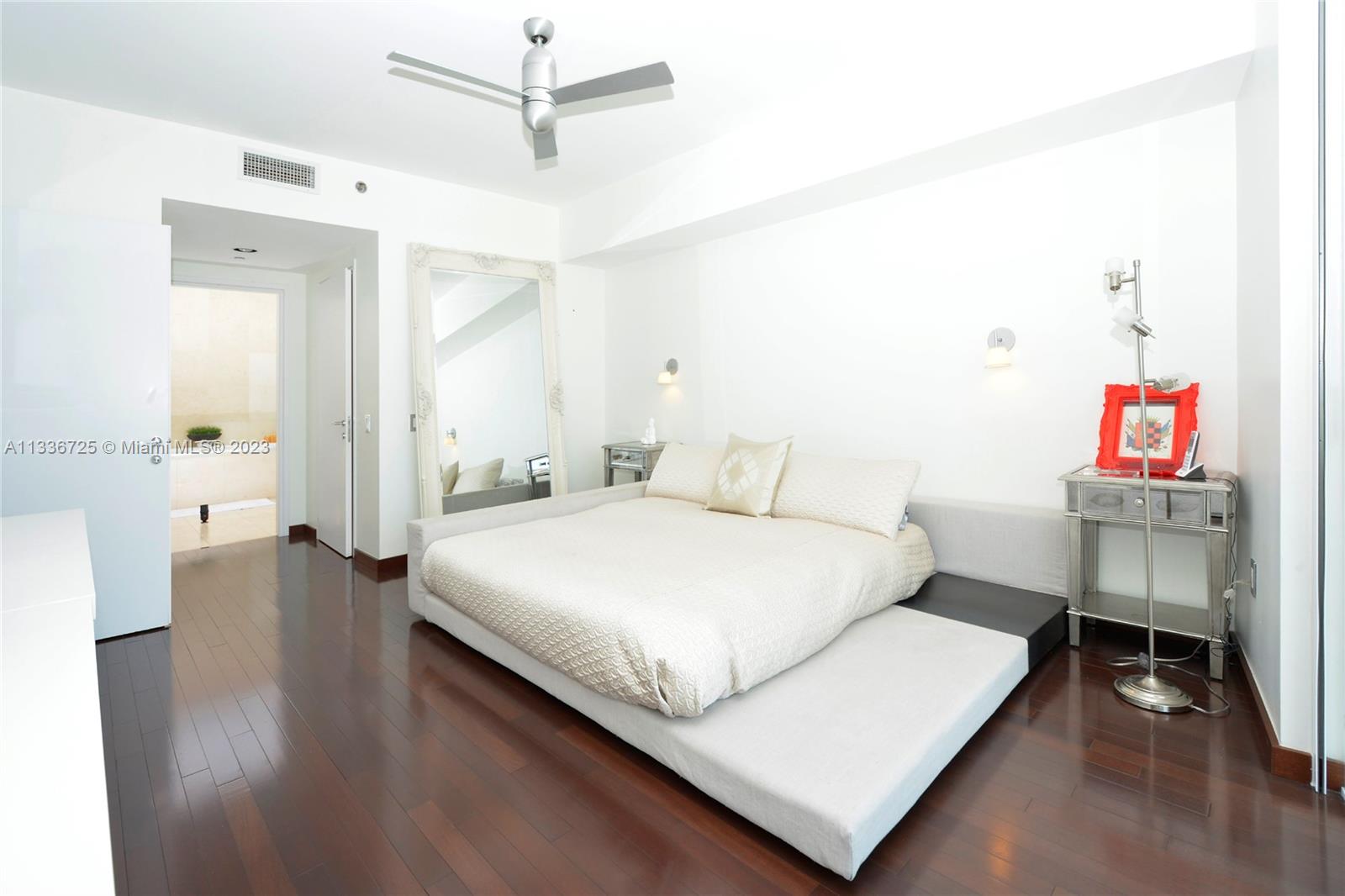 450 Alton Road, Unit 2006 Miami Beach, FL 33139 - Photo 12 of 34 a bedroom with a bed and a table