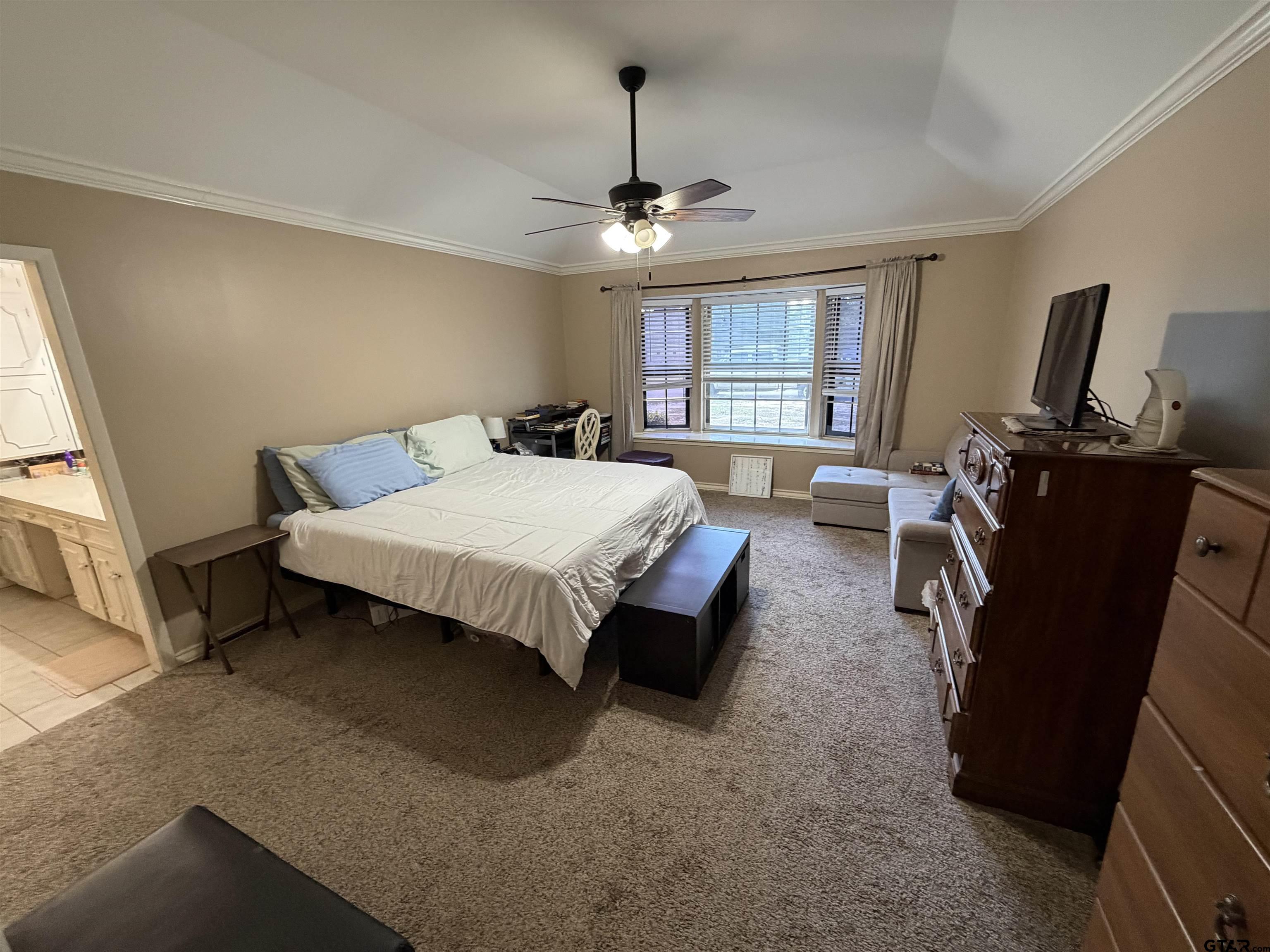 5704 Foxcroft Road Tyler, TX 75703 - Photo 7 of 10 a bed room with a bed window and dresser
