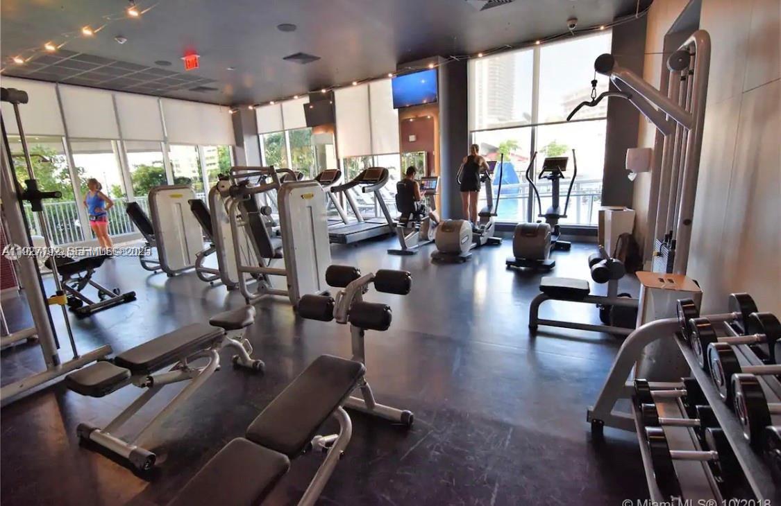 2602 East Hallandale Beach Boulevard, Unit R708 Hallandale Beach, FL 33009 - Photo 39 of 42 a view of a room with gym equipment