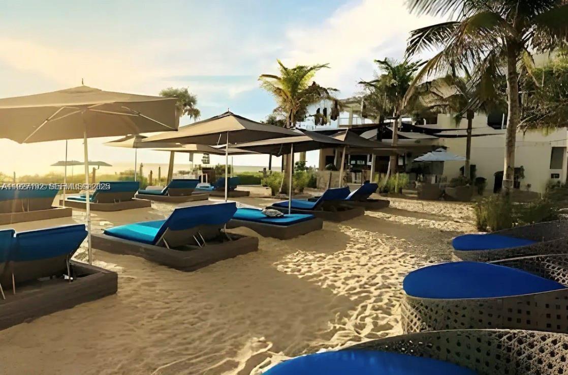 2602 East Hallandale Beach Boulevard, Unit R708 Hallandale Beach, FL 33009 - Photo 42 of 42 a view of a swimming pool with lounge chairs