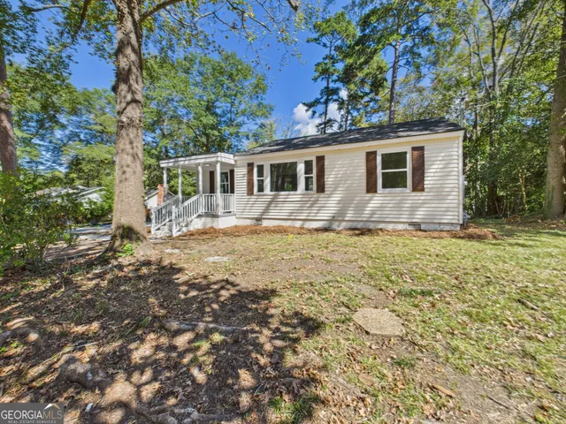 a house with trees in the background