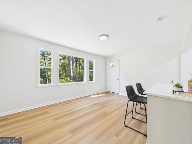 a view of a livingroom with furniture and wooden floor