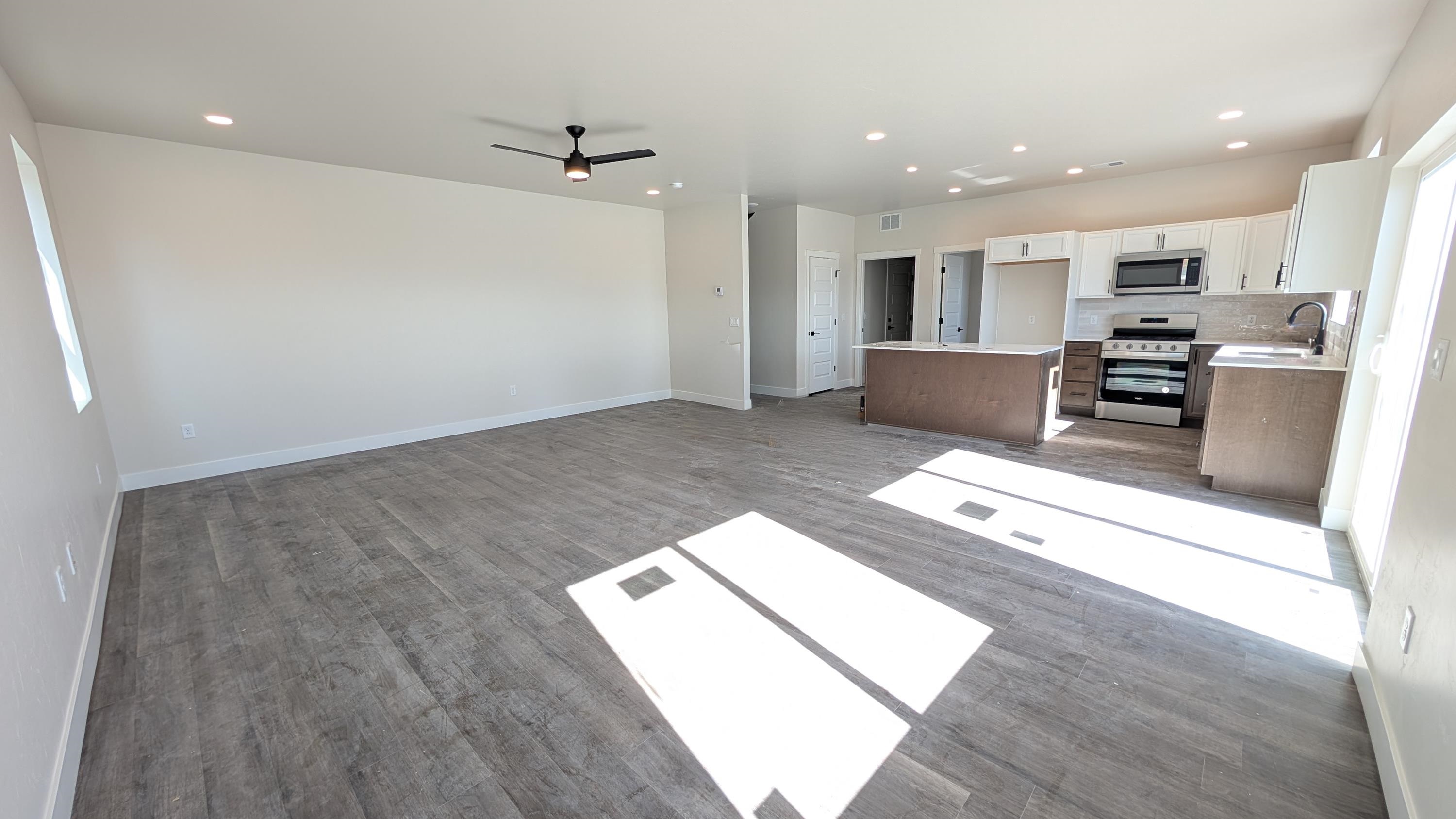 2463 Revere Road, Unit A Grand Junction, CO 81505 - Photo 3 of 13 a living room with stainless steel appliances furniture and a kitchen view