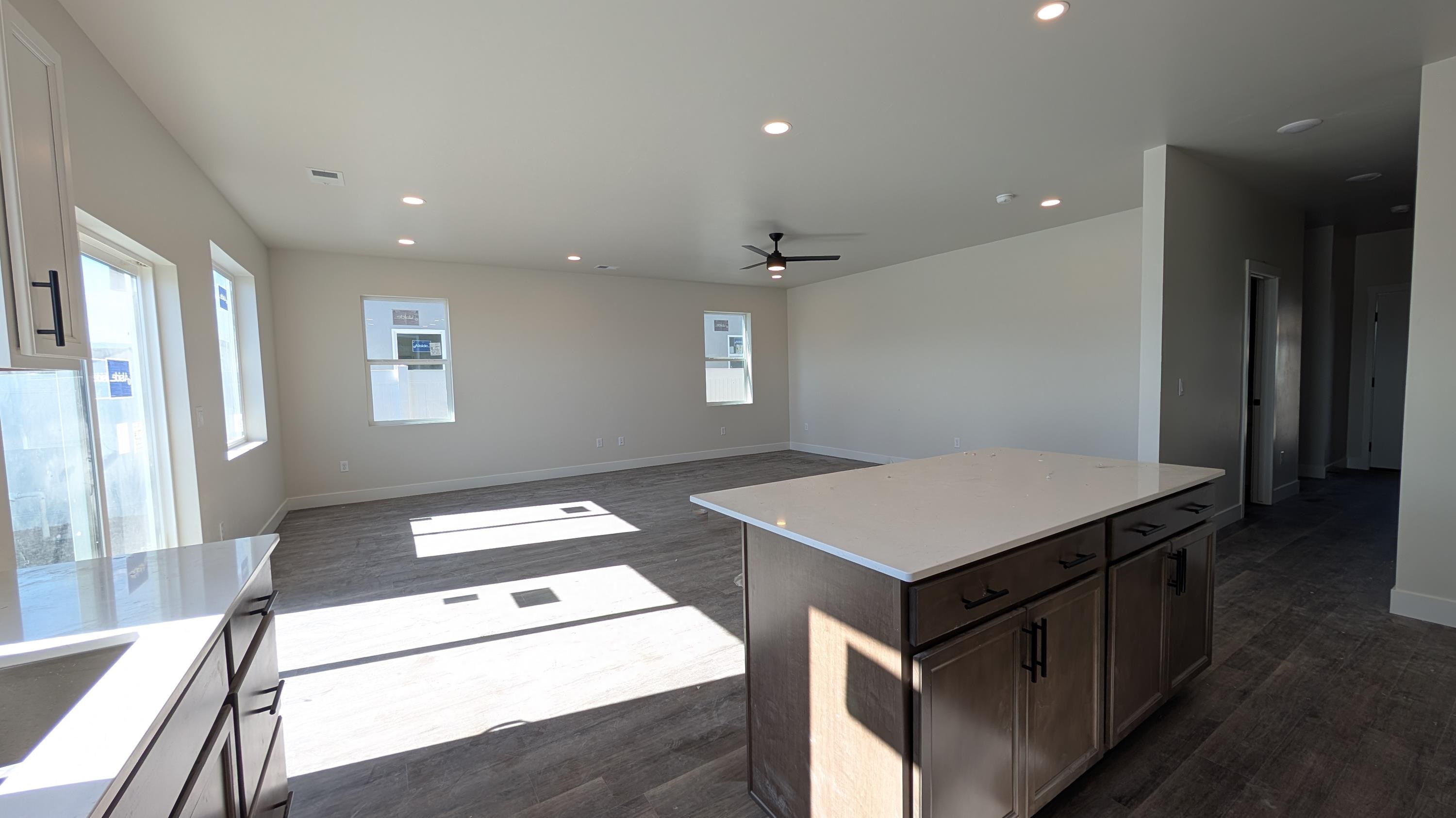 2463 Revere Road, Unit A Grand Junction, CO 81505 - Photo 4 of 13 a kitchen that has a sink a stove and a refrigerator
