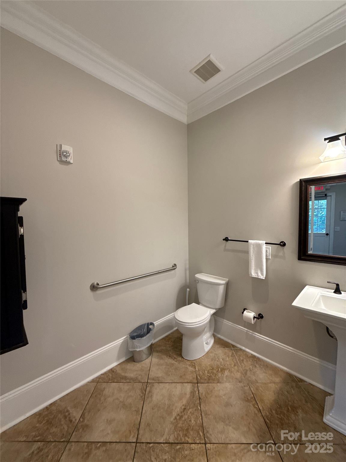 13931 Thompson Road Charlotte, NC 28227 - Photo 13 of 41 a white toilet sitting next to a bathroom sink