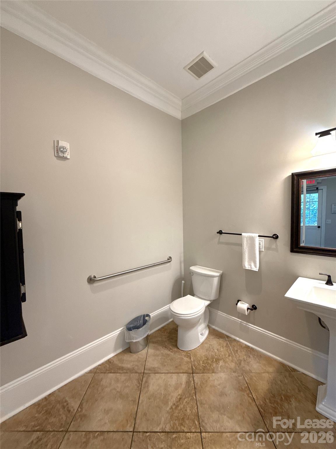 13931 Thompson Road Charlotte, NC 28227 - Photo 15 of 43 a white toilet sitting next to a bathroom sink