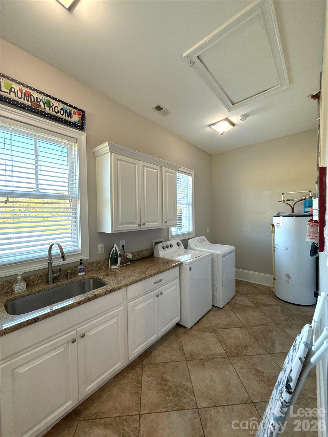 13931 Thompson Road Charlotte, NC 28227 - Photo 16 of 43 a kitchen with a sink and cabinets