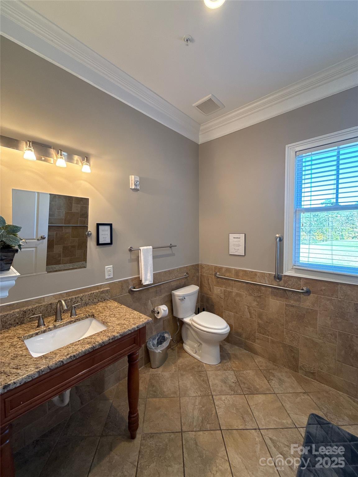 13931 Thompson Road Charlotte, NC 28227 - Photo 19 of 41 a spacious bathroom with a sink and a mirror