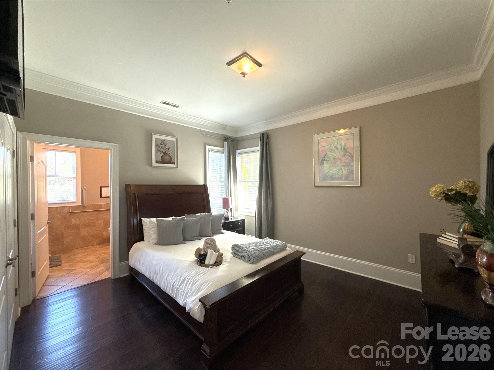 13931 Thompson Road Charlotte, NC 28227 - Photo 23 of 43 a bedroom with a bed and wooden floor