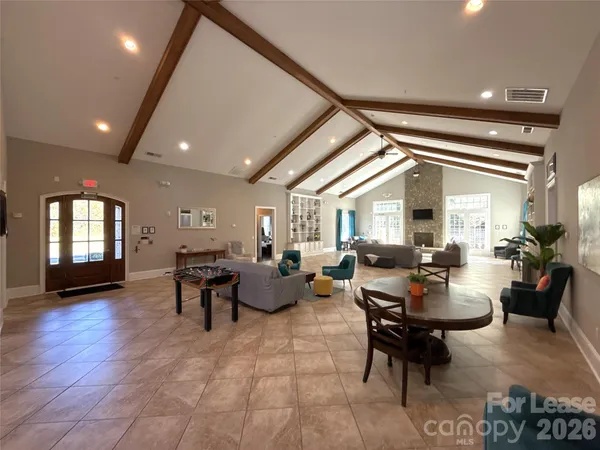 a living room with fireplace furniture and a window