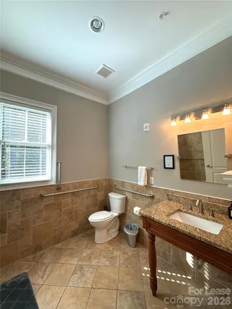 a bathroom with a shower and a sink