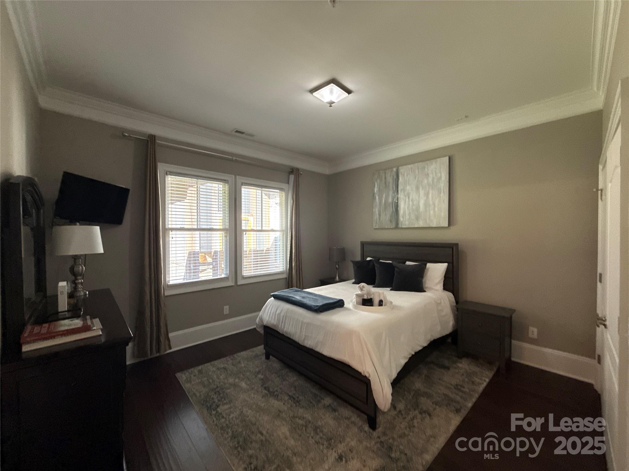 13931 Thompson Road Charlotte, NC 28227 - Photo 35 of 41 a bed sitting in a bedroom next to a window