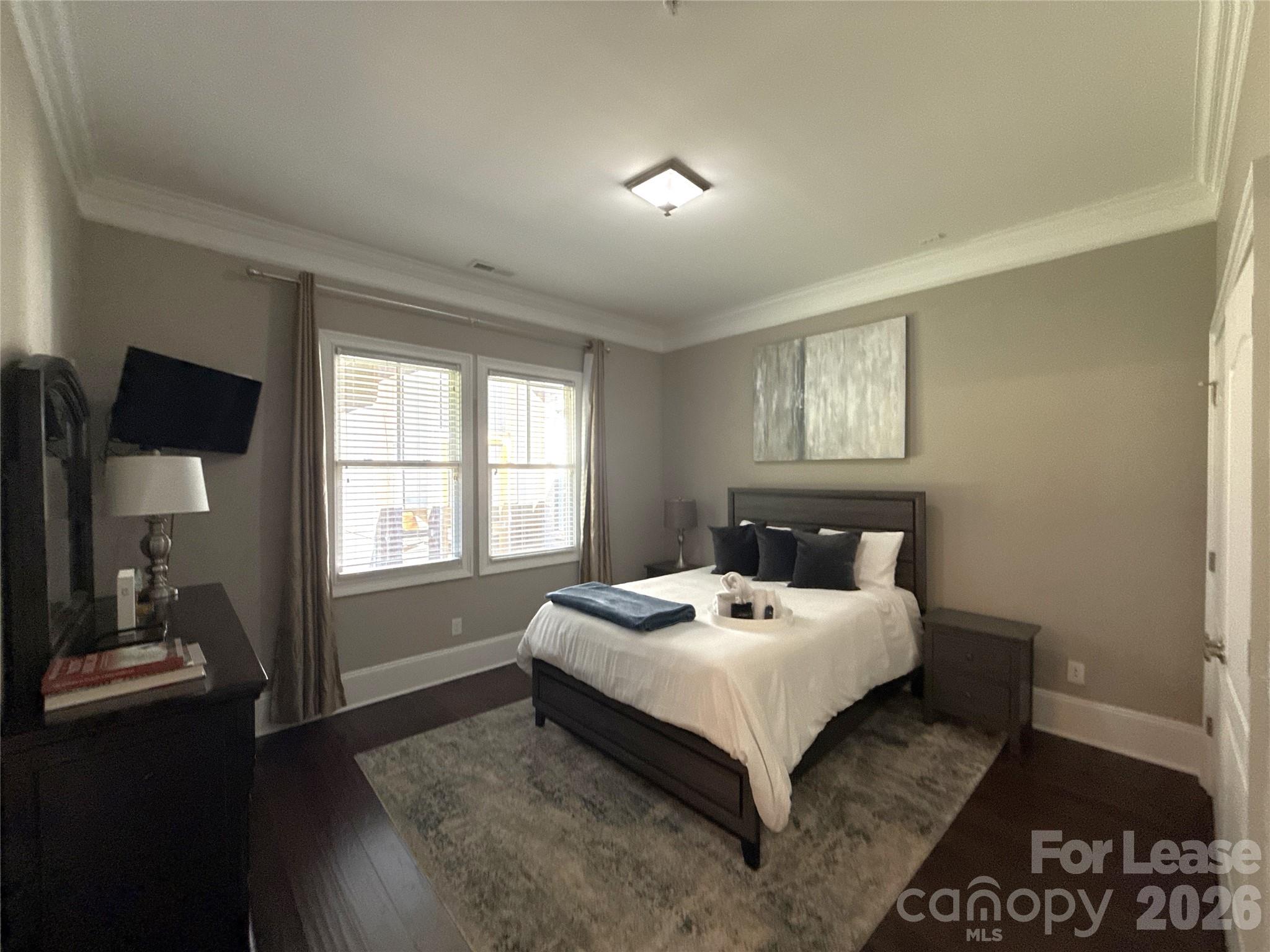 13931 Thompson Road Charlotte, NC 28227 - Photo 37 of 43 a bed sitting in a bedroom next to a window