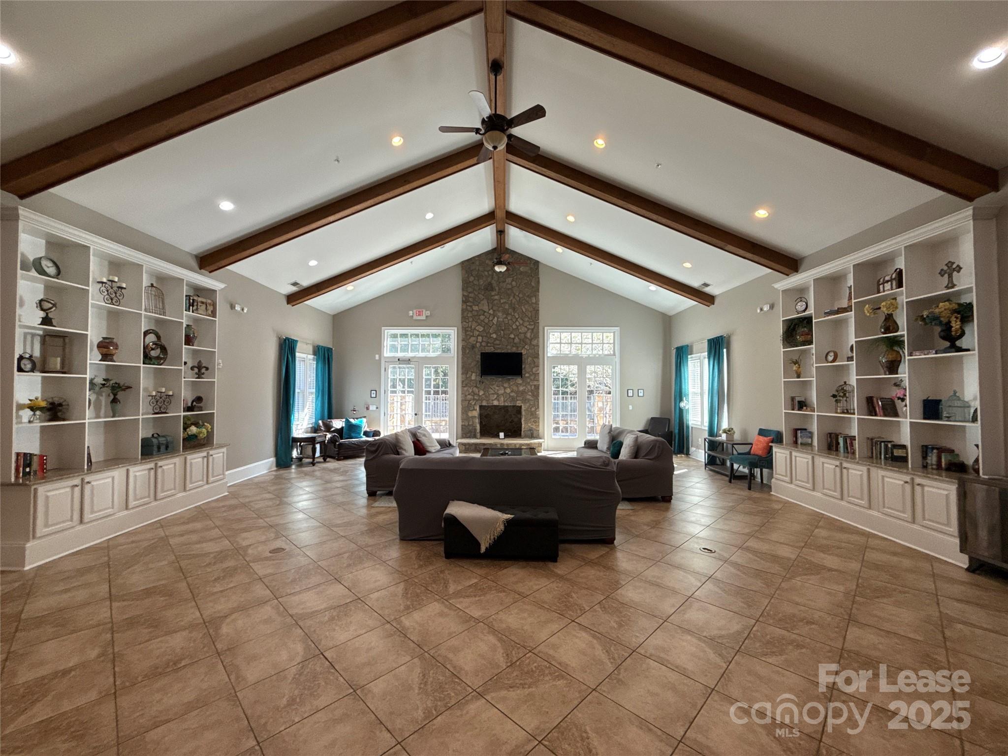 13931 Thompson Road Charlotte, NC 28227 - Photo 4 of 41 a living room with furniture a fireplace and a chandelier