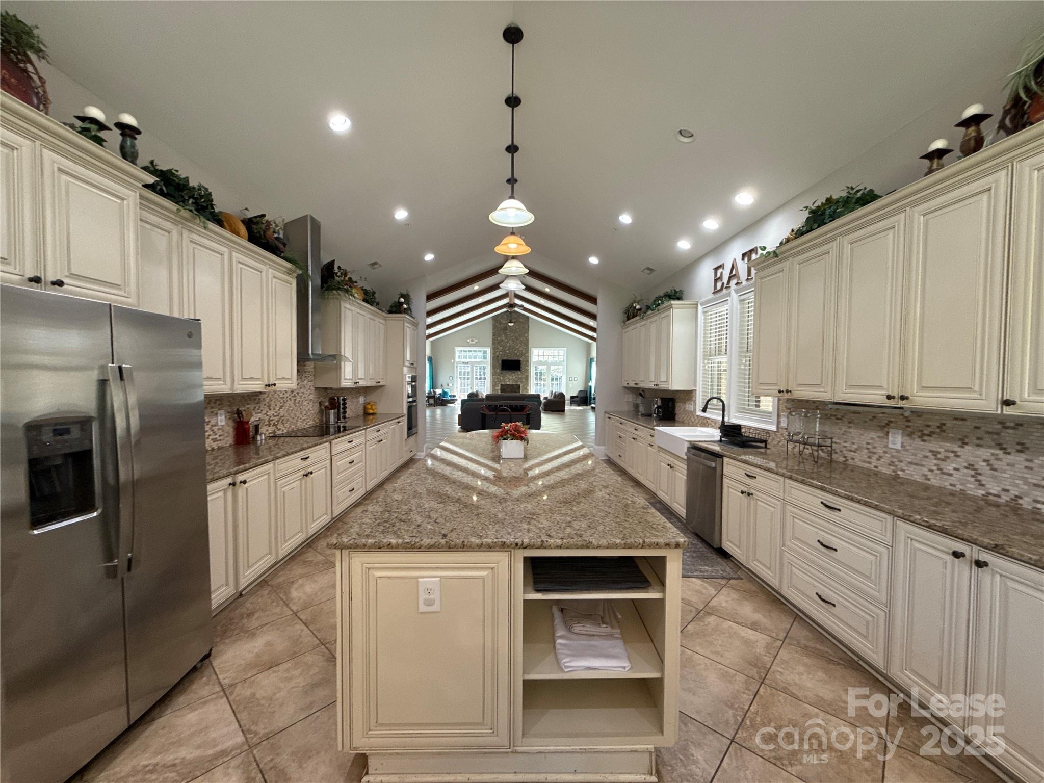 13931 Thompson Road Charlotte, NC 28227 - Photo 10 of 41 a large kitchen with granite countertop a large counter top stainless steel appliances and cabinets