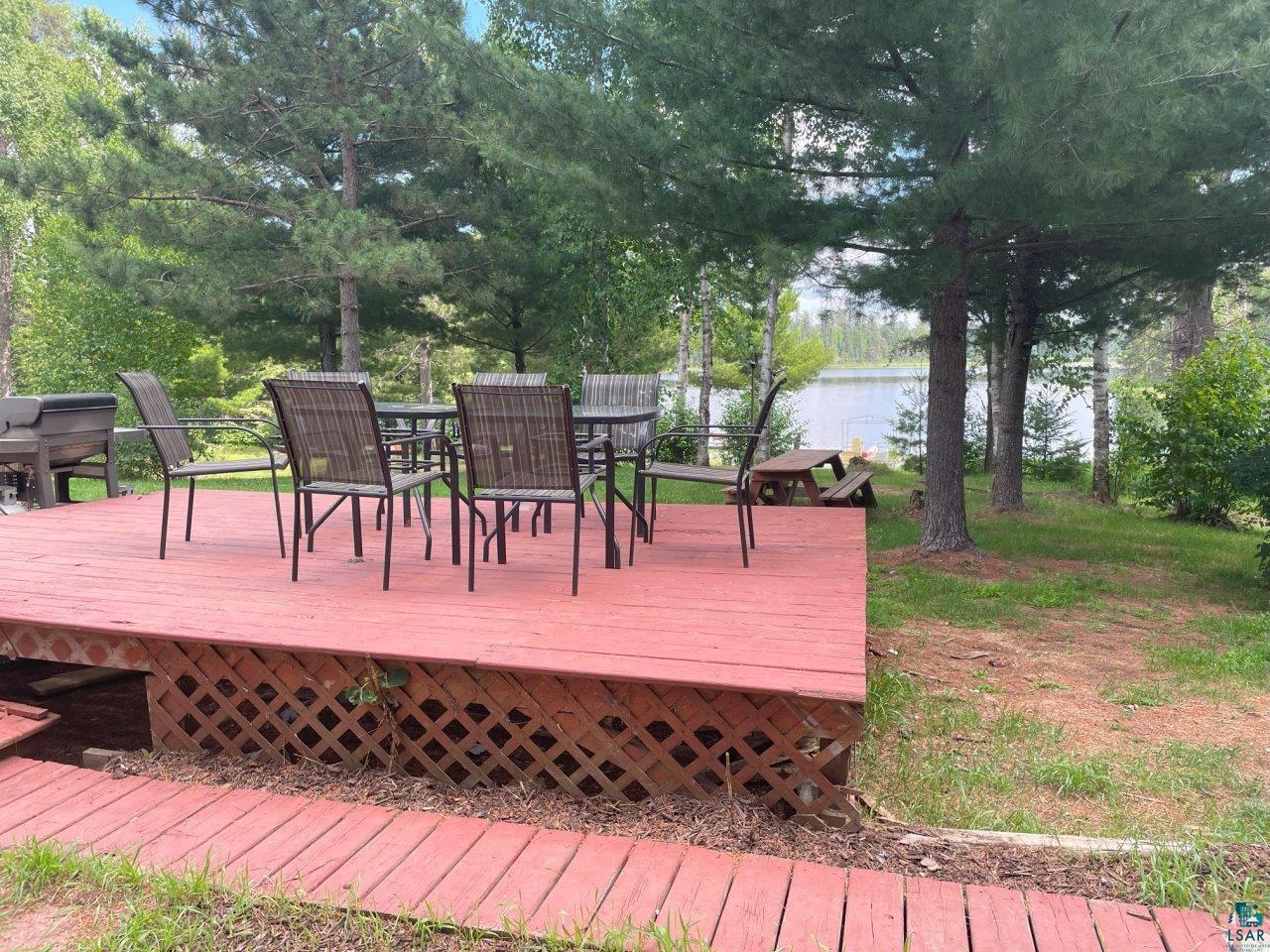 3420 Dewees Road Babbitt, MN 55706 - Photo 43 of 58 Deck with outdoor dining area and a water view