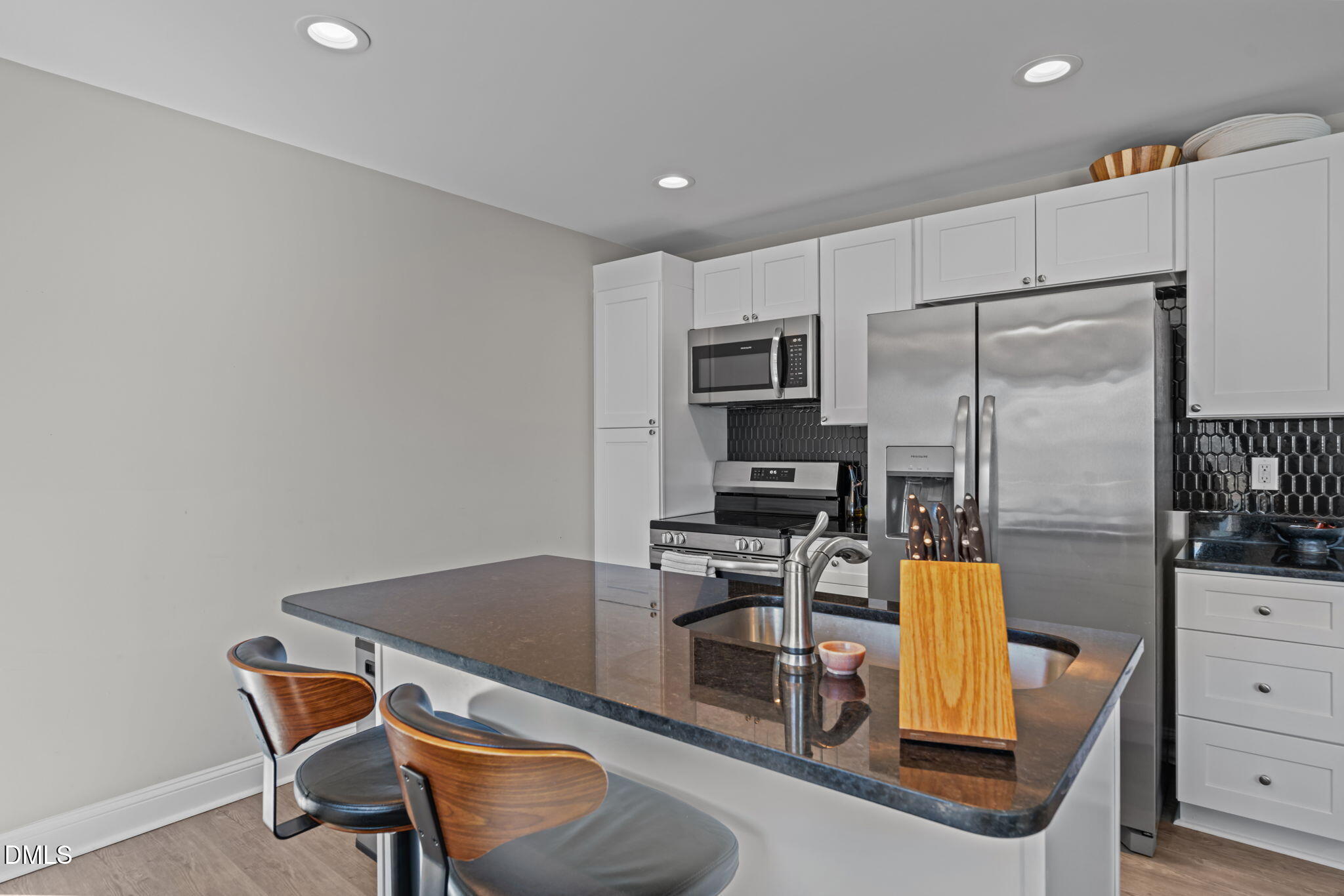 904 Allstar Avenue Cameron, NC 28326 - Photo 13 of 34 a kitchen with a refrigerator and table chair