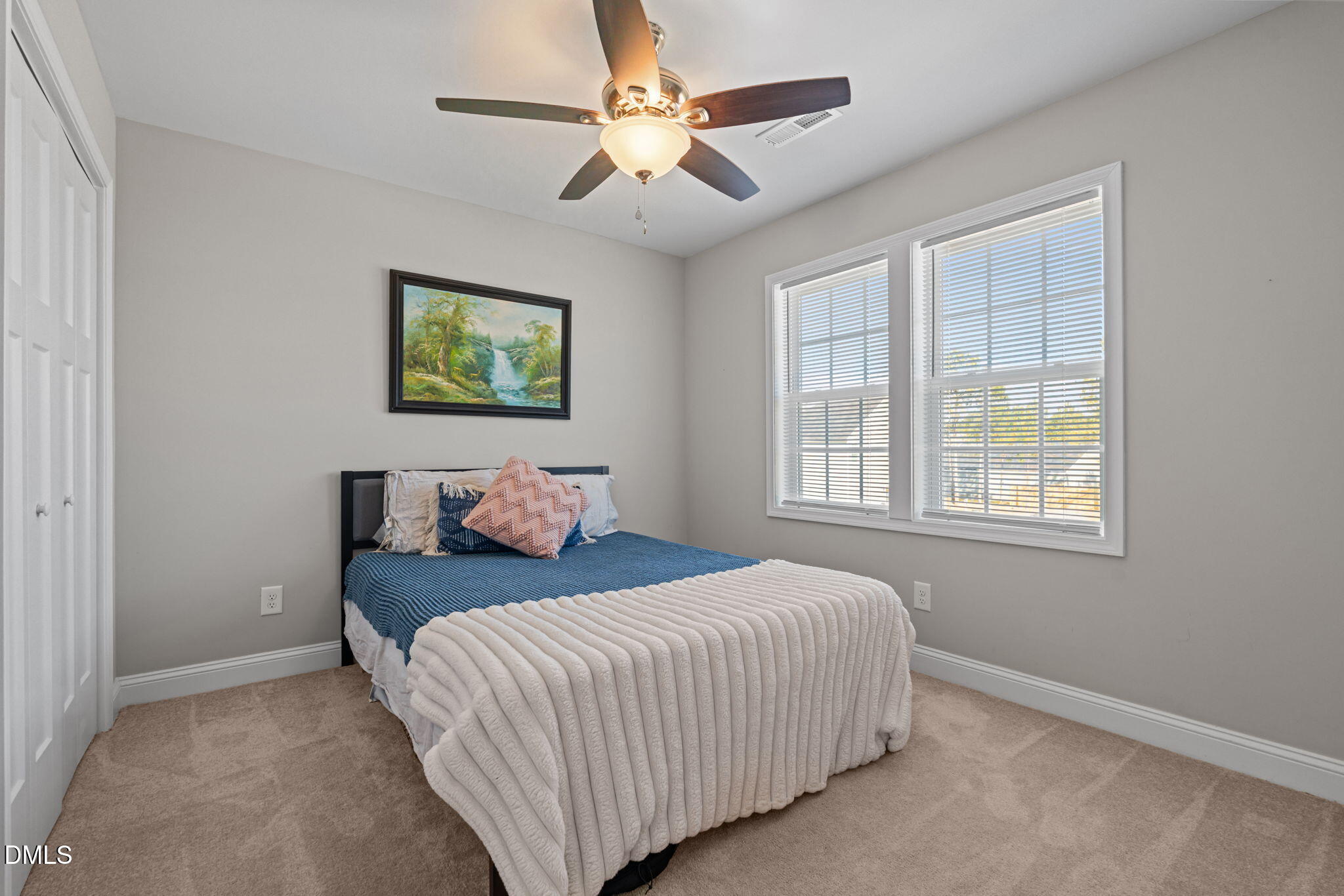 904 Allstar Avenue Cameron, NC 28326 - Photo 16 of 34 a bedroom with a bed and a painting on the wall