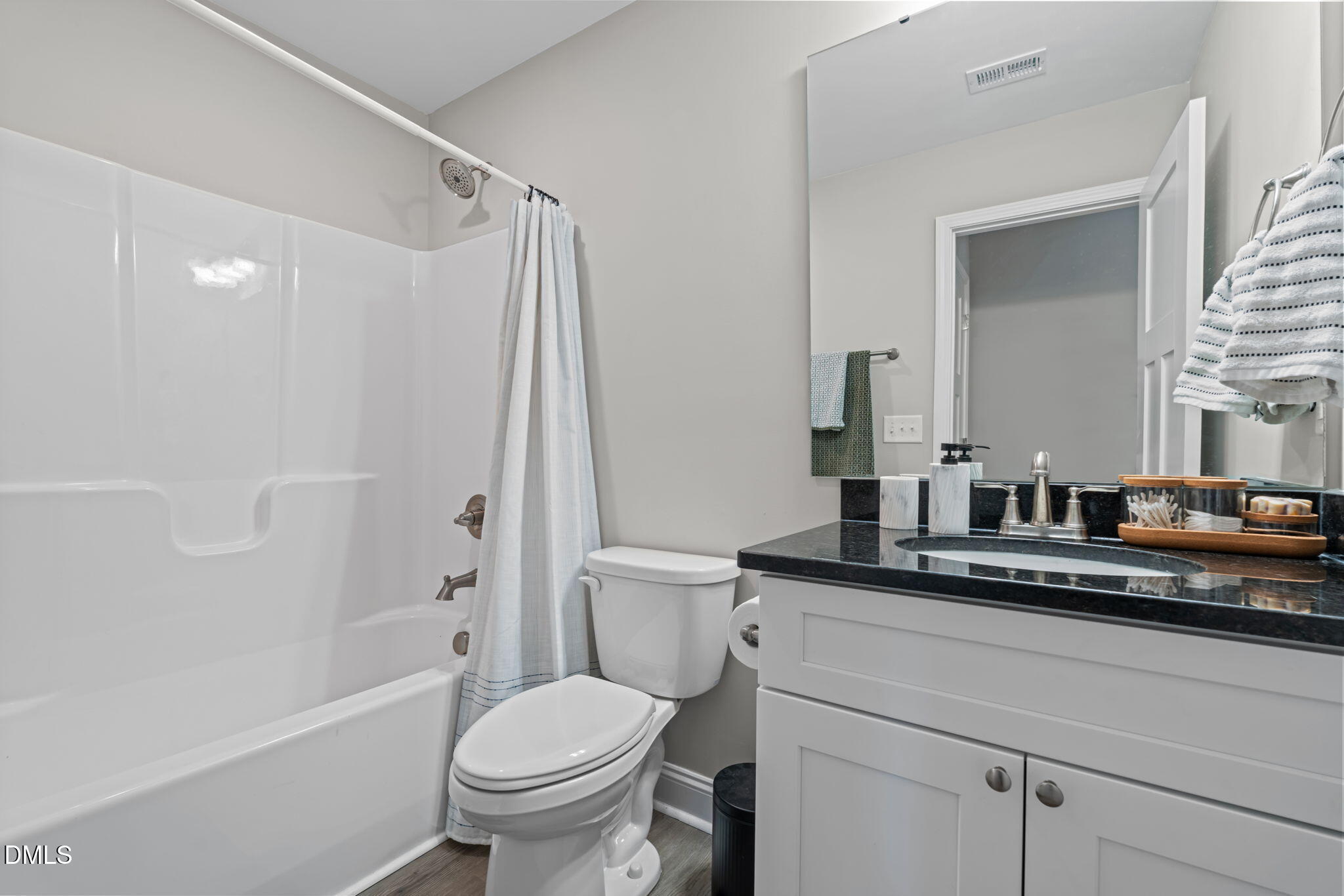 904 Allstar Avenue Cameron, NC 28326 - Photo 17 of 34 a bathroom with a granite countertop sink a toilet and a mirror