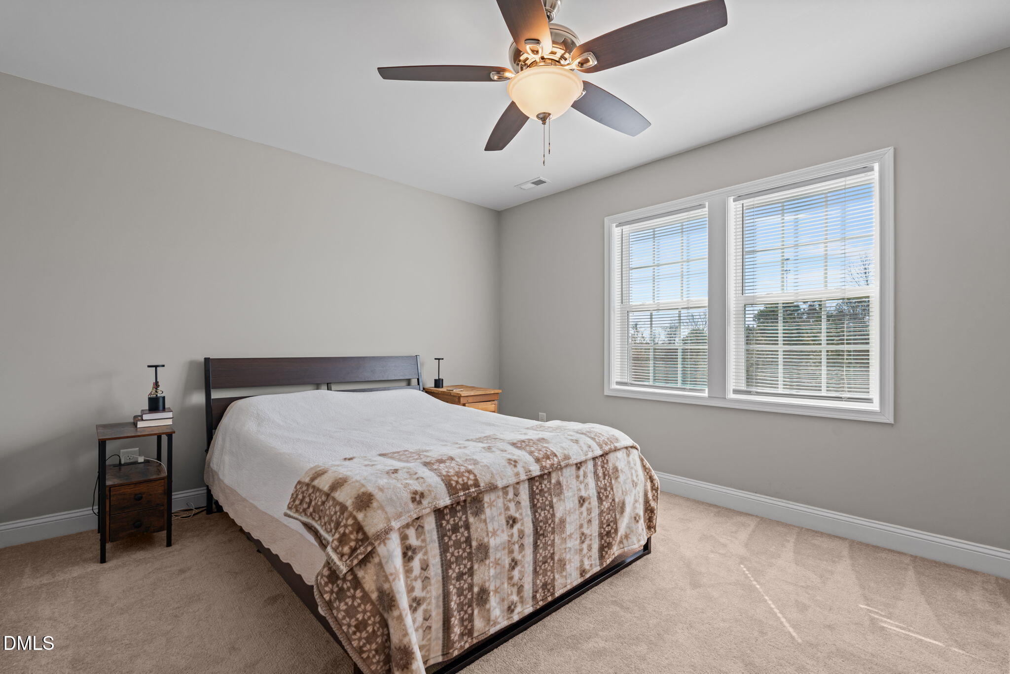 904 Allstar Avenue Cameron, NC 28326 - Photo 19 of 34 a bedroom with a bed chandelier and a window