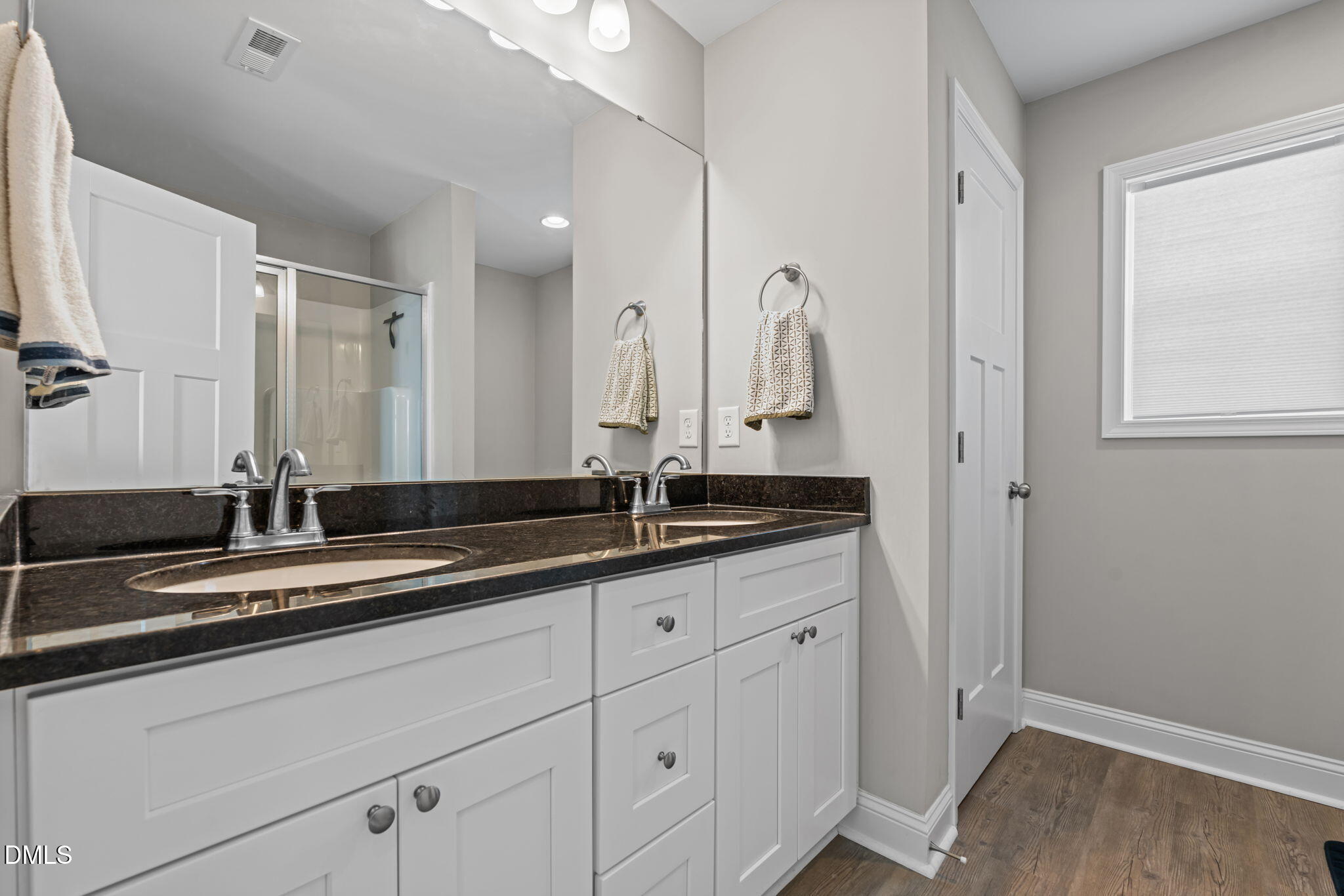 904 Allstar Avenue Cameron, NC 28326 - Photo 23 of 34 a bathroom with a double vanity sink and a mirror