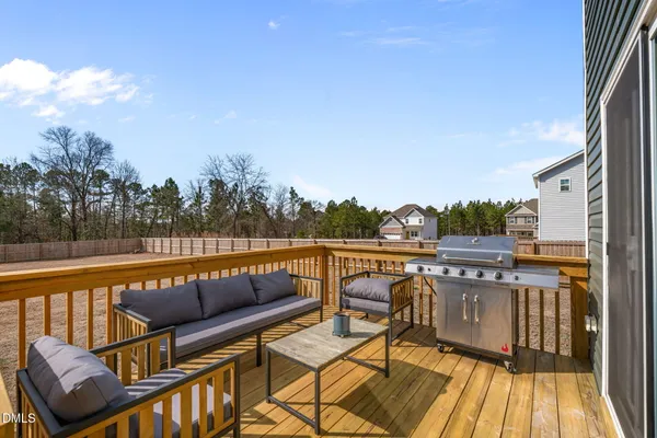a terrace with outdoor seating and city view