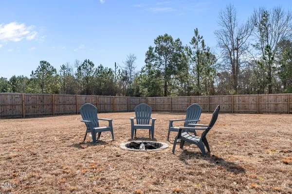 a view of a bench in the backyard