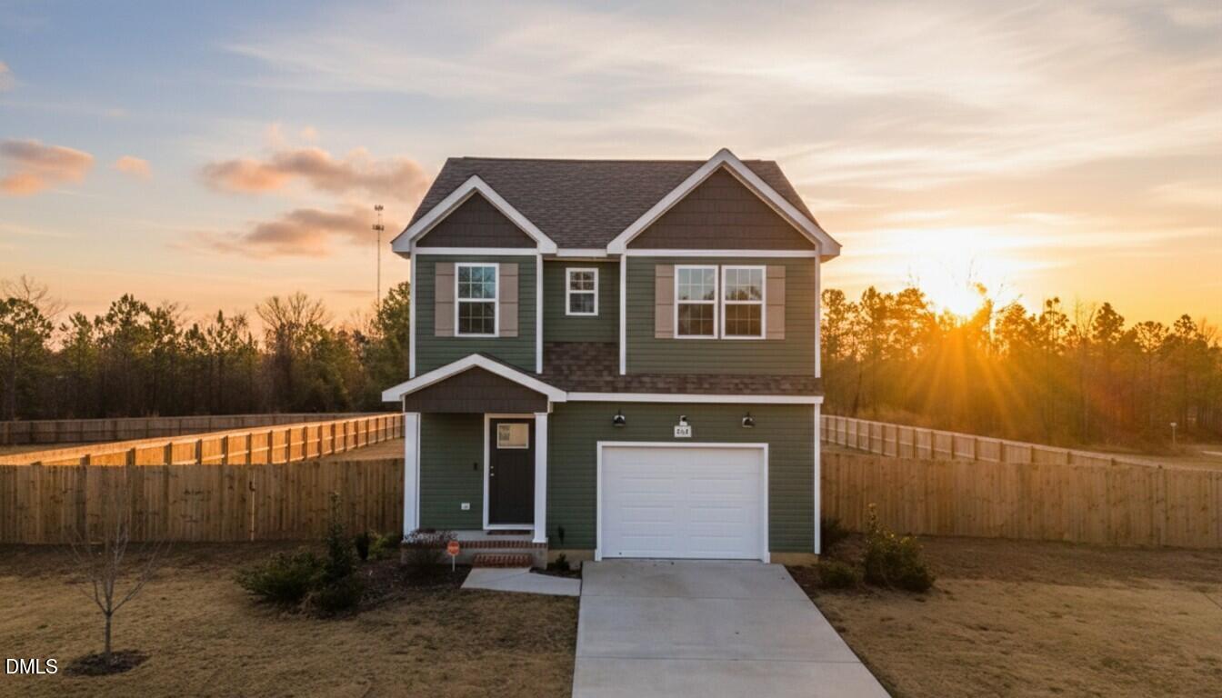 904 Allstar Avenue Cameron, NC 28326 - Photo 2 of 34 a front view of a house with a yard and garage