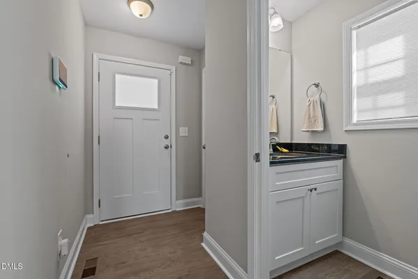 a view of kitchen with wooden floor