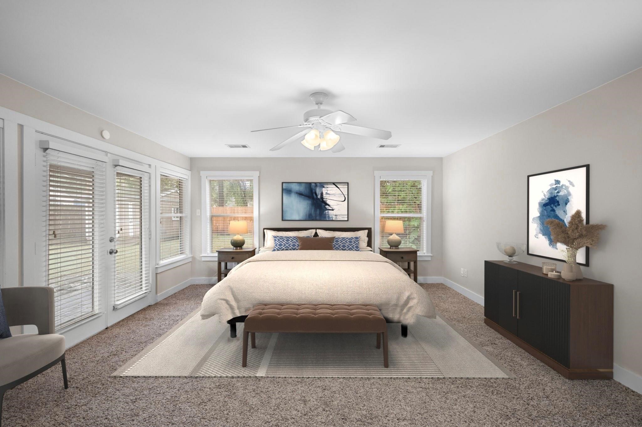 954 West 41st Street Houston, TX 77018 - Photo 12 of 19 a bedroom with a large bed and a chandelier