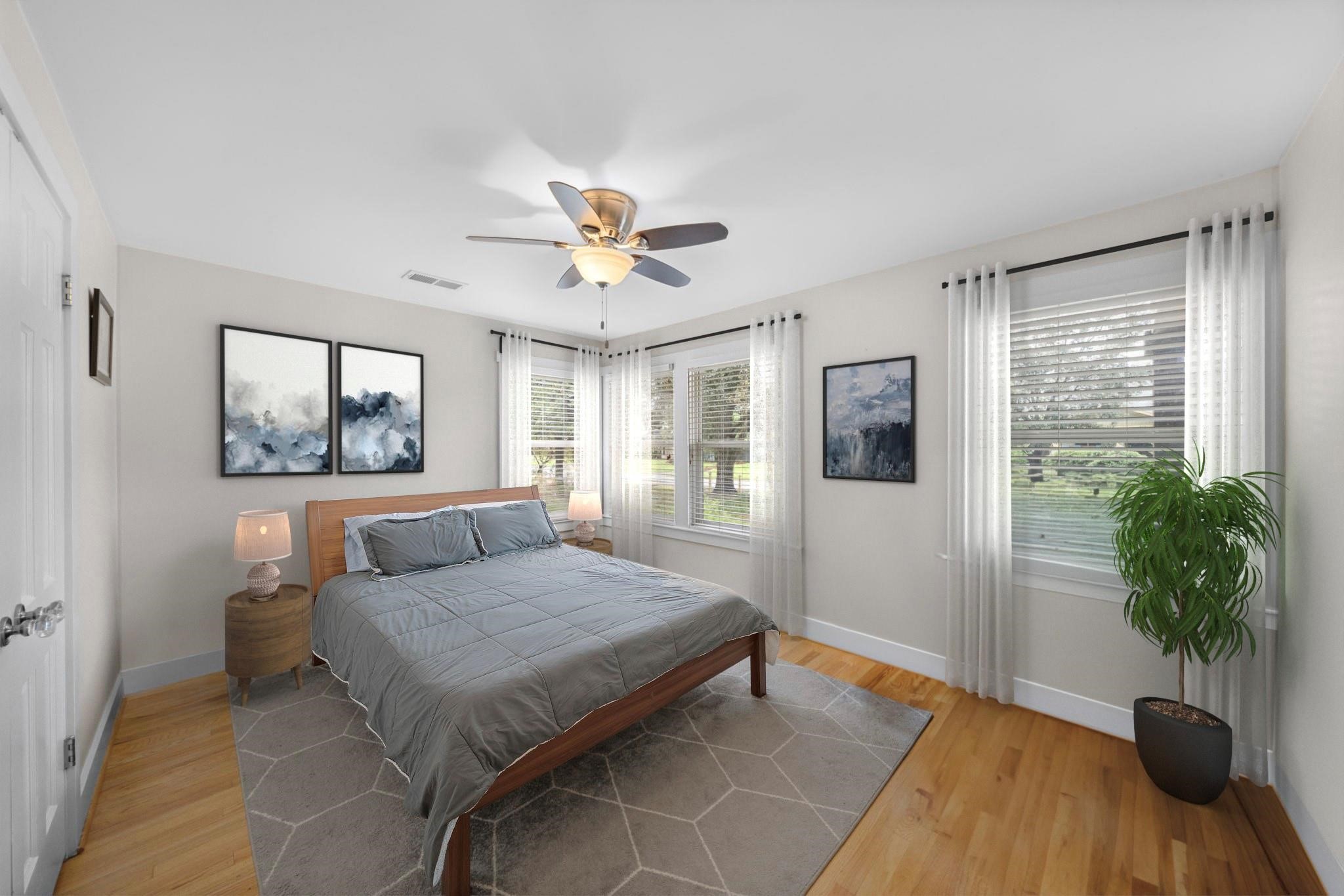 954 West 41st Street Houston, TX 77018 - Photo 15 of 19 a bedroom with a large bed and a window