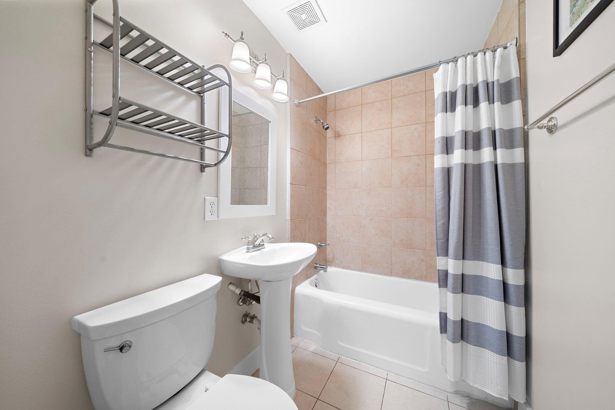 954 West 41st Street Houston, TX 77018 - Photo 17 of 19 a bathroom with a sink a toilet and shower