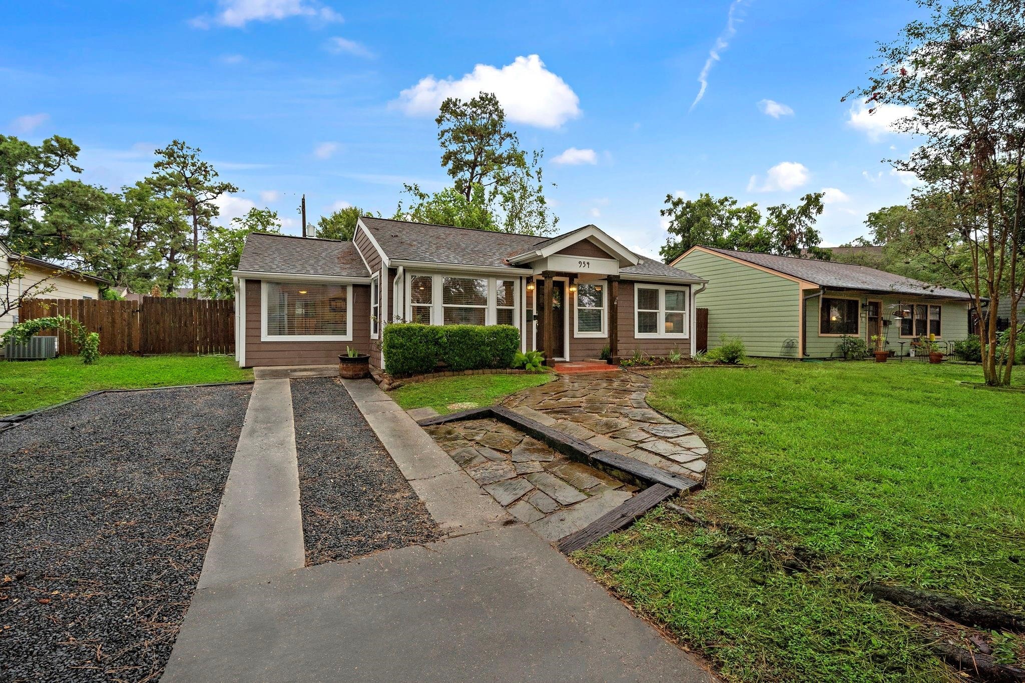 954 West 41st Street Houston, TX 77018 - Photo 3 of 19 a front view of a house with a yard