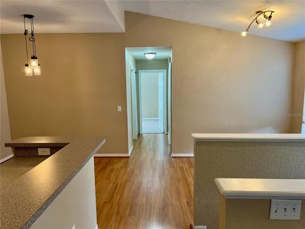 a hallway with wooden floor
