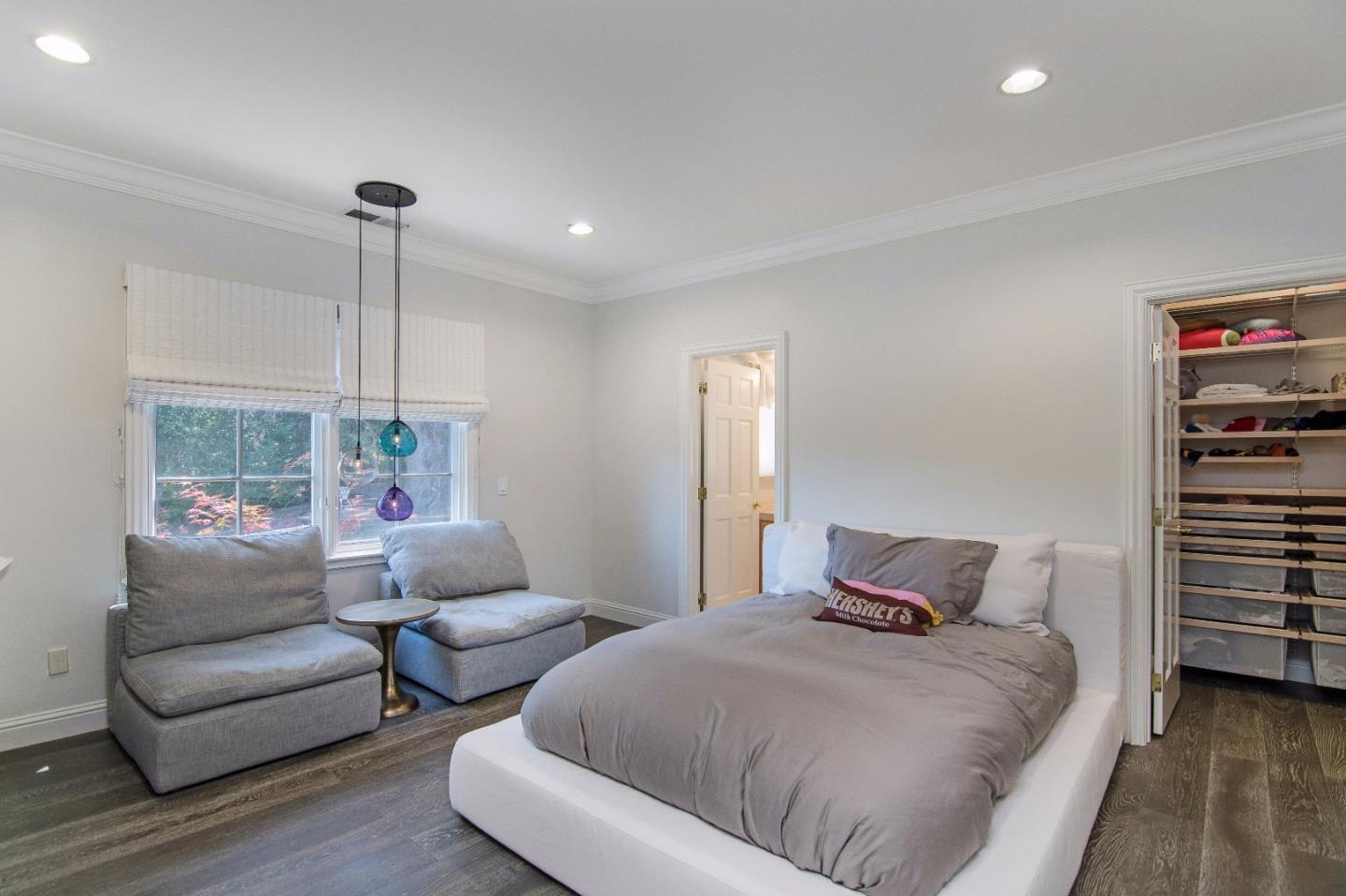 37 Valley Road Atherton, CA 94027 - Photo 16 of 26 a bedroom with furniture and a large window