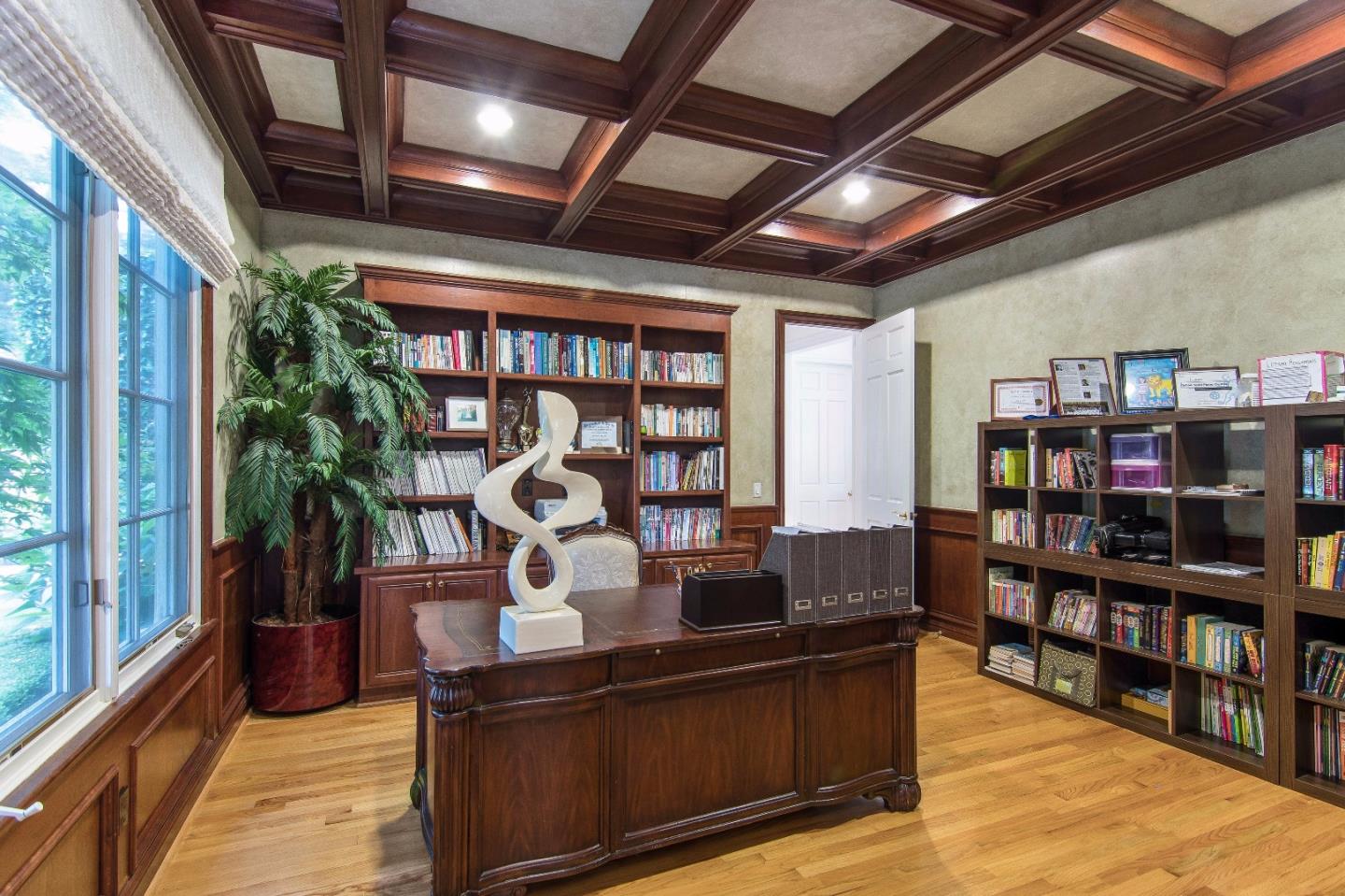 37 Valley Road Atherton, CA 94027 - Photo 8 of 26 a living room with lots of furniture and a book shelf