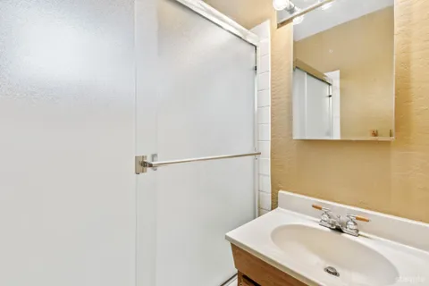 a bathroom with a sink and mirror