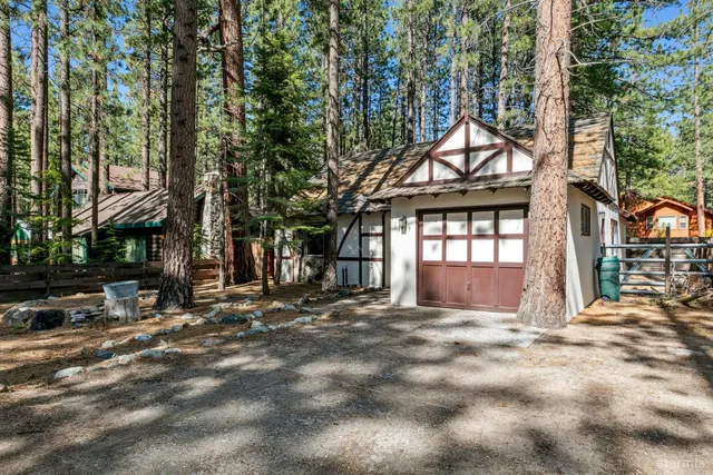 a view of a house with a tree in the background