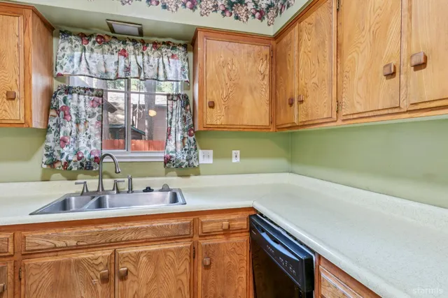 a kitchen with a sink and a window