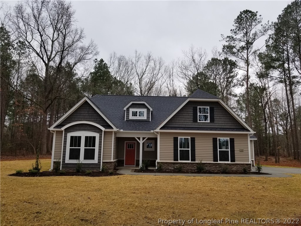 5090 J T Matthews Road Godwin, NC 28344 - Photo 1 of 7 a front view of a house with a yard