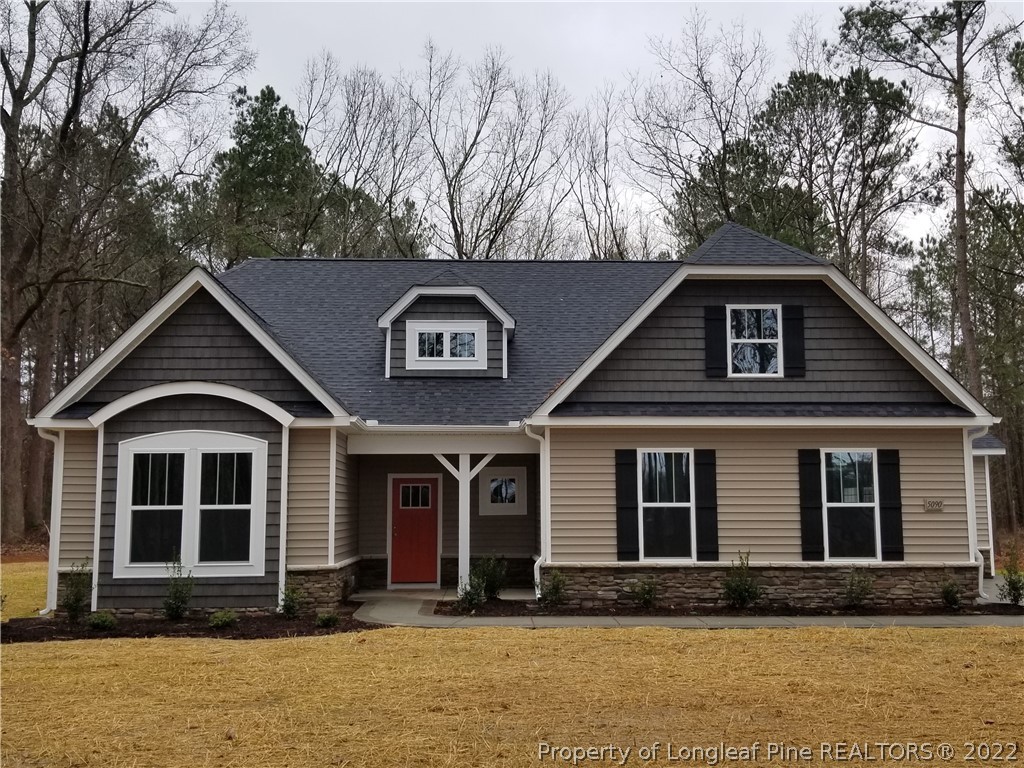 5090 J T Matthews Road Godwin, NC 28344 - Photo 2 of 7 a front view of a house with yard