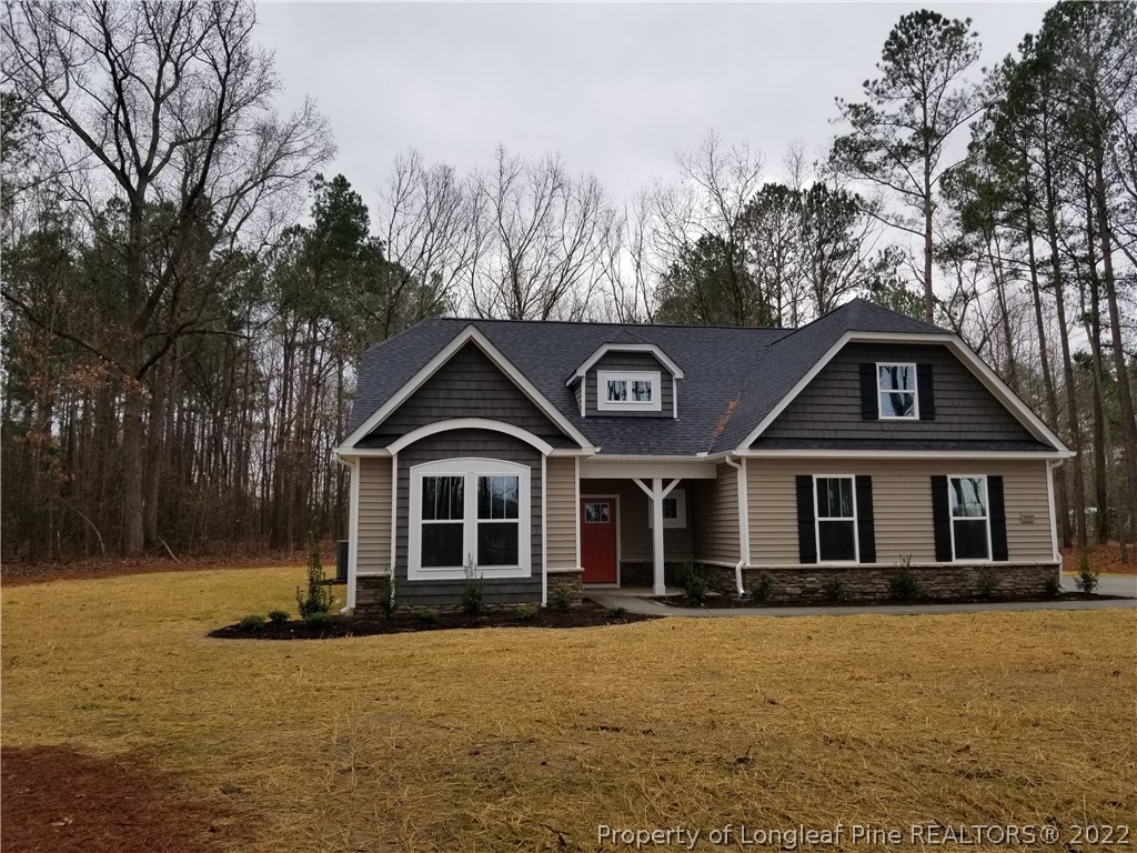 5090 J T Matthews Road Godwin, NC 28344 - Photo 3 of 7 a front view of a house with a yard