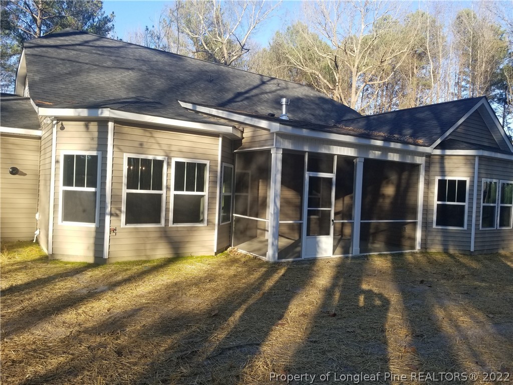5090 J T Matthews Road Godwin, NC 28344 - Photo 5 of 7 a view of a house with a large window