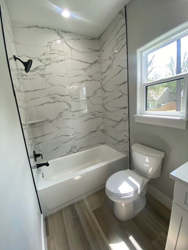 116 Field Street Luling, TX 78648 - Photo 20 of 33 A well-appointed bath with striking tiled shower and a window for natural light.