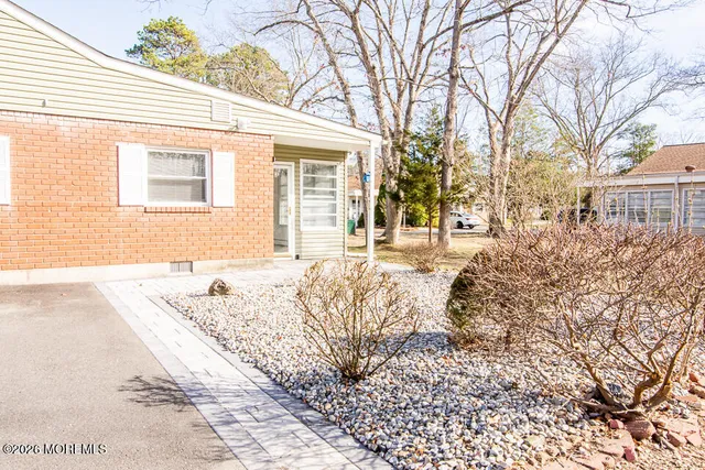 a view of a house with a snow on the road